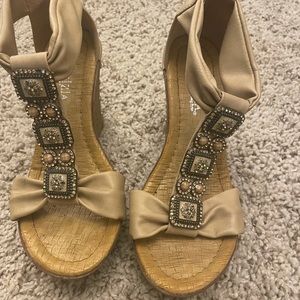 Women's light tan wedge sandal with beautiful crystal detail. Size 6.5.